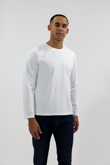 front view of model wearing Easy Mondays off white colored long sleeved crew neck sweatshirt