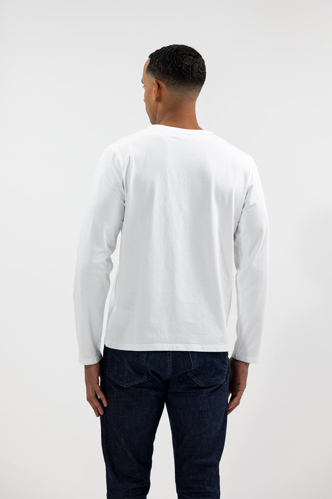 back view of model wearing Easy Mondays off white colored long sleeved crew neck sweatshirt