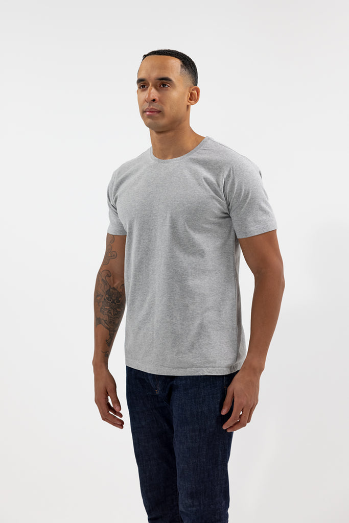 angled side view of model wearing Easy Mondays light grey heather crew neck tee shirt