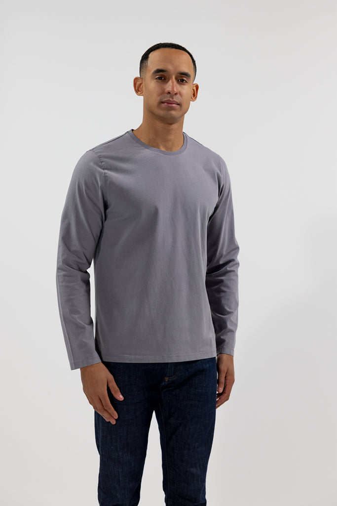 front view of model wearing Easy Mondays medium grey slate colored long sleeved crew neck sweatshirt