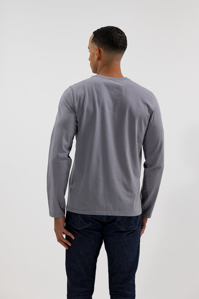 back view of model wearing Easy Mondays medium grey slate colored long sleeved crew neck sweatshirt