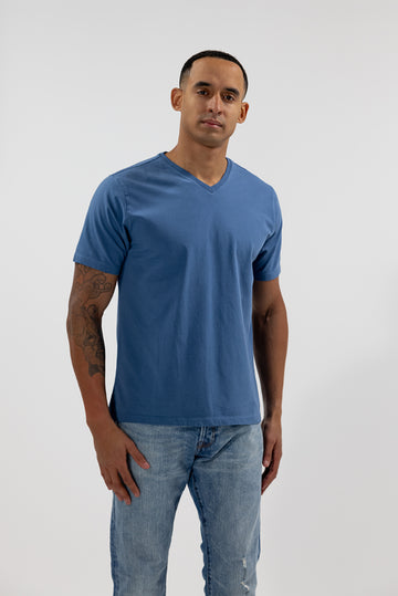 front of model wearing Easy Mondays ocean blue v neck tee shirt
