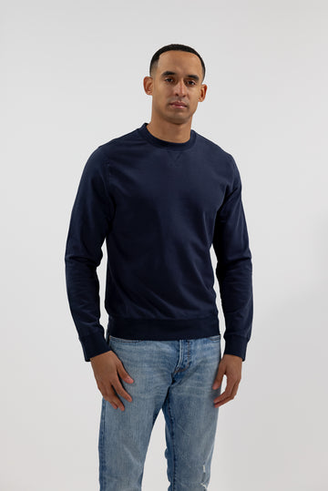 front view of model wearing Easy Mondays crew neck sweatshirt in dark blue navy color