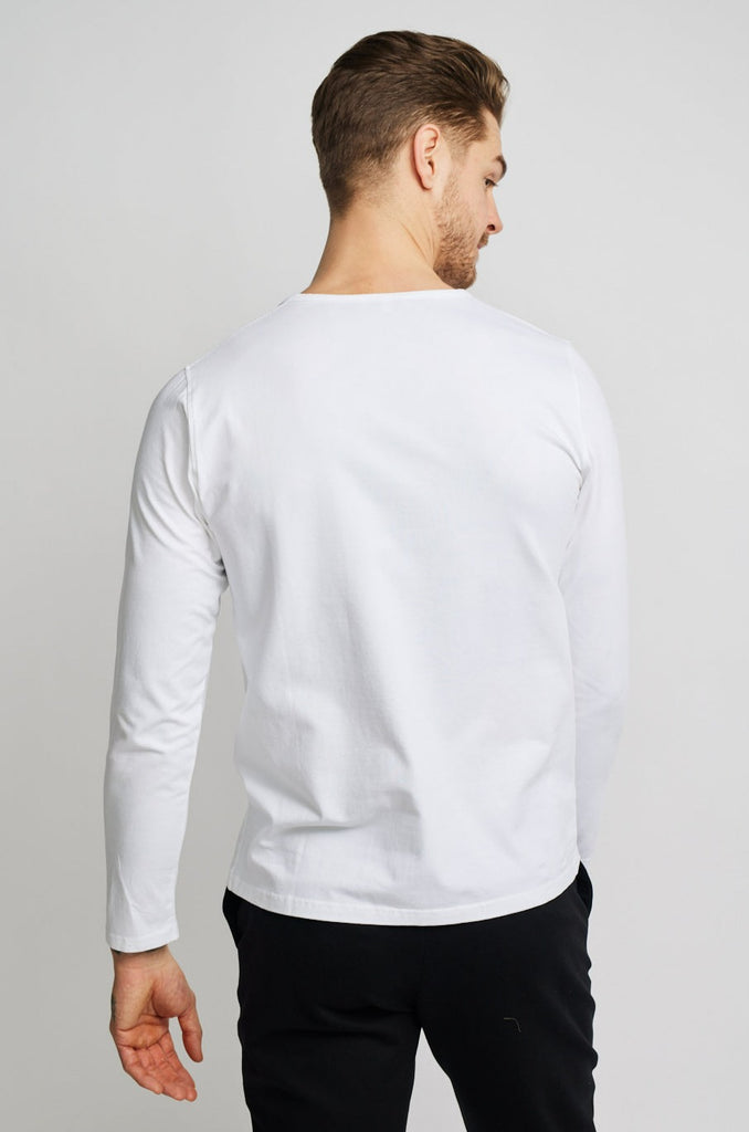 back of model wearing Easy Mondays brand long-sleeved white henley shirt with color matched buttons