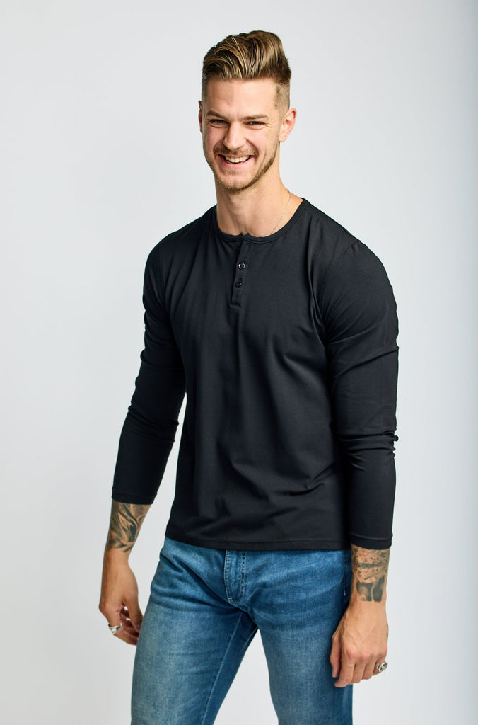 front of model wearing Easy Mondays brand black Henley shirt with color matched buttons