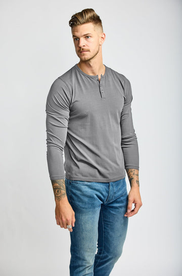 front of model wearing Easy Mondays brand Henley shirt in medium grey slate color with color matched buttons