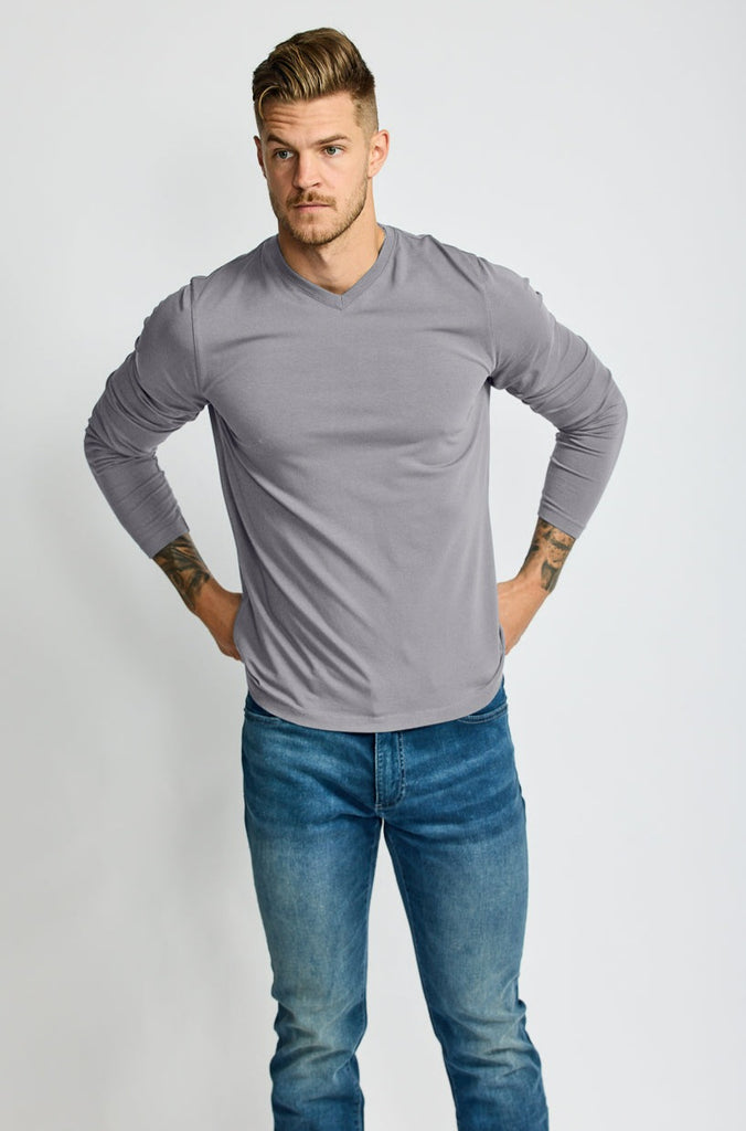 front of model wearing Easy Mondays brand v neck long sleeved shirt in medium grey slate color