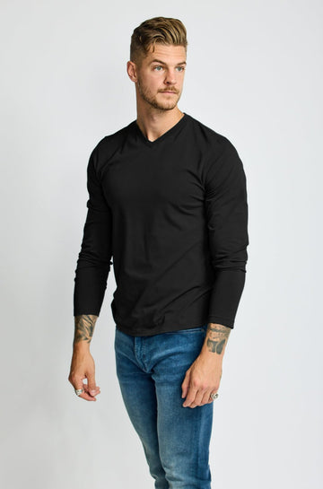 front of model wearing Easy Mondays brand black v neck tee shirt 