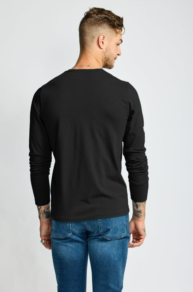 back of model wearing Easy Mondays brand black v neck tee shirt