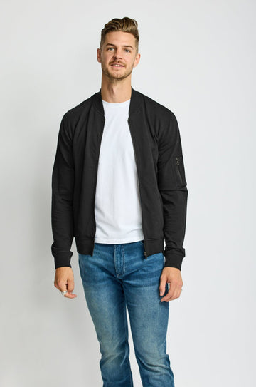 front of model wearing Easy Mondays brand full-zip black fleece bomber jacket 